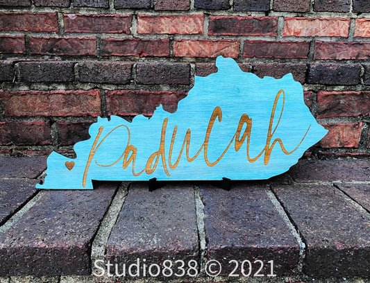 Kentucky (Paducah) shaped state sign.  Your choice- table top or door hanger.  Customized to your city!